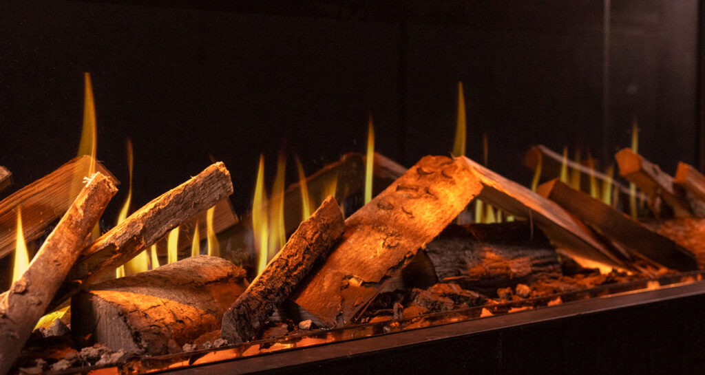 Closeup of the Luxury Logscape Real Woodland Log Set installed in the Onyx Fusion 150RW electric fire